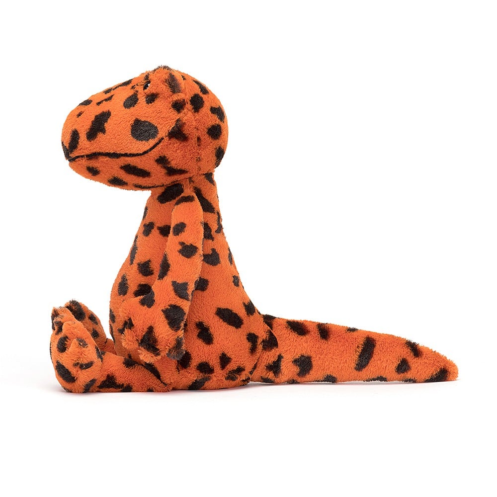 Jellycat Syd Salamander plush toy with black spotted orange fur, black bead eyes and a stitched smile, side view.