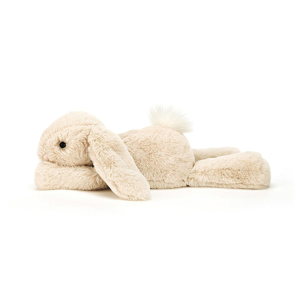 Jellycat Medium Smudge Rabbit, tan bunny plush toy lying down, side view.