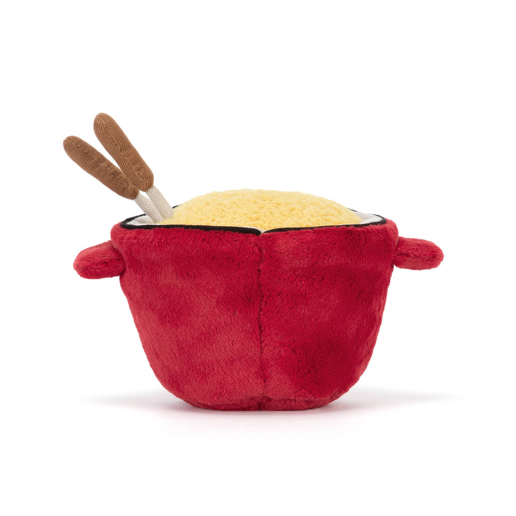 Plush red cheese fondue pot with a smiling face and fondue forks, back view on a white background.
