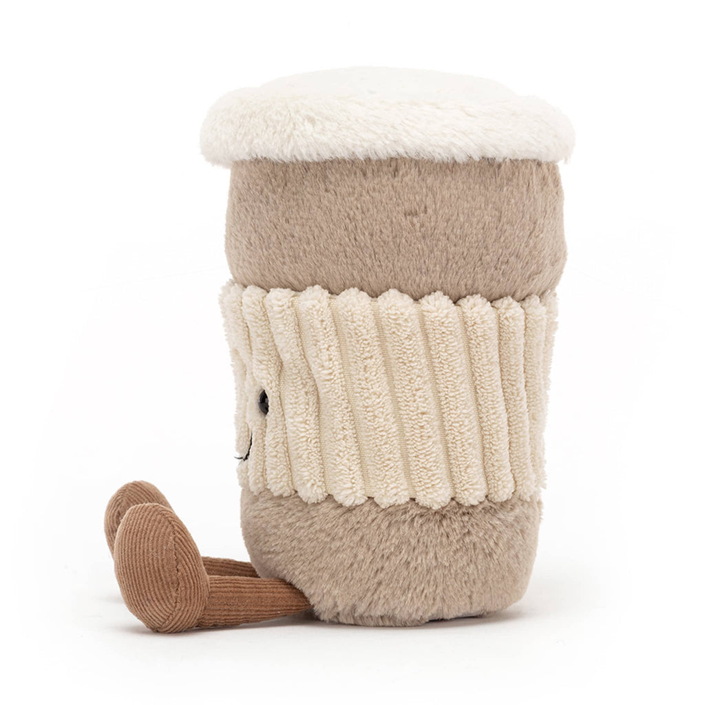 Jellycat Amuseable Coffee-to-Go plush toy with black bead eyes, stitched smile and brown corduroy legs, side view.