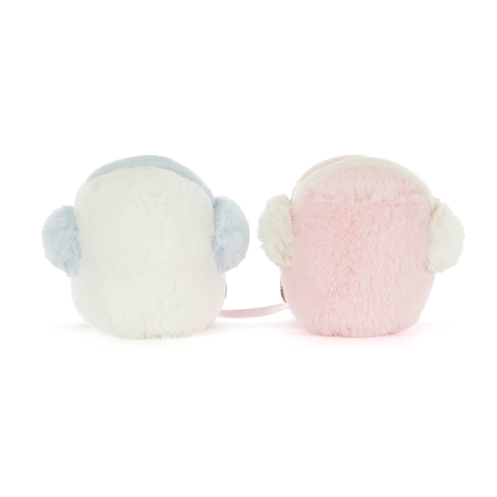 A pink and a white plush marshmallow with earmuffs, back view on a white background.