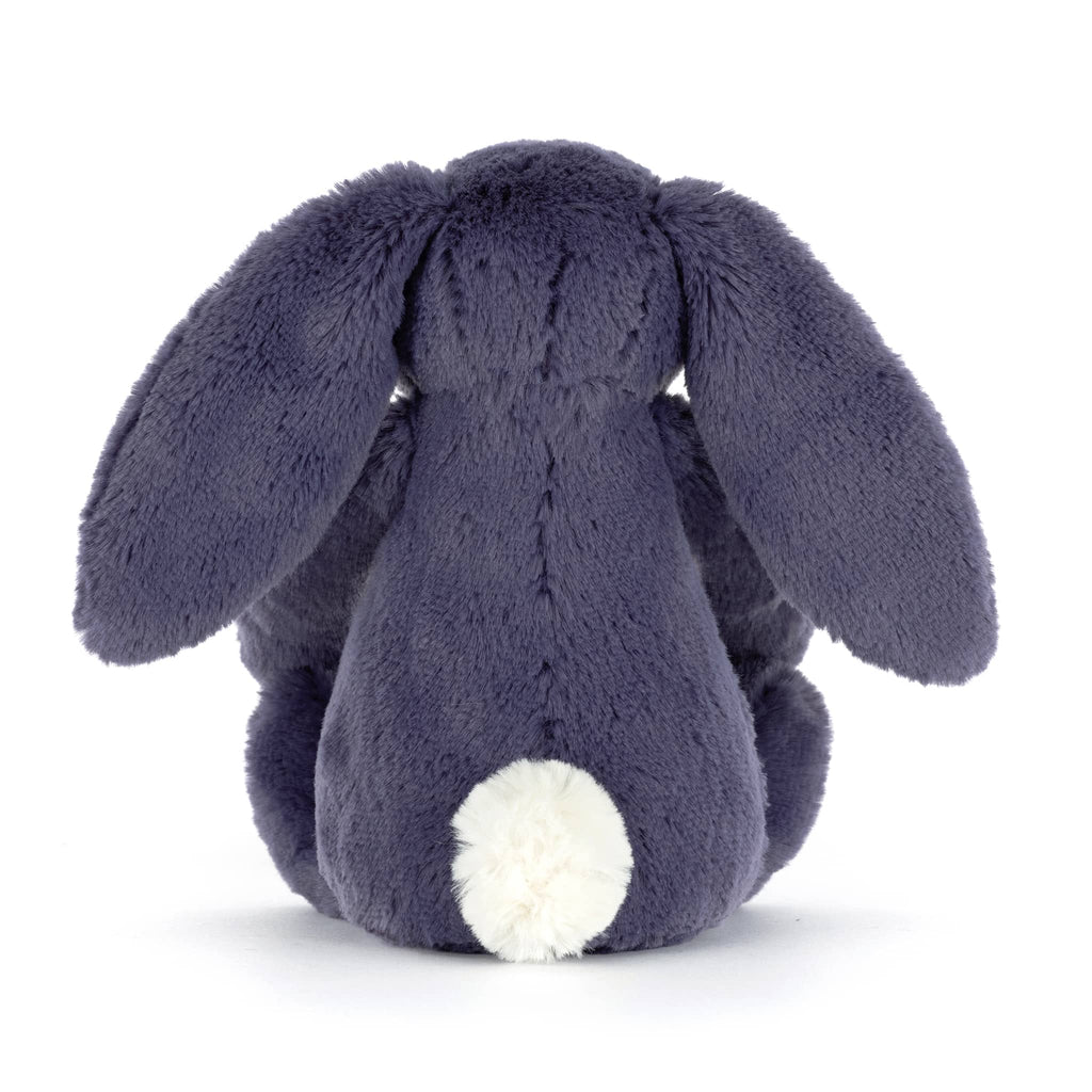 Dark blue plush bunny toy, back view, on a white background.