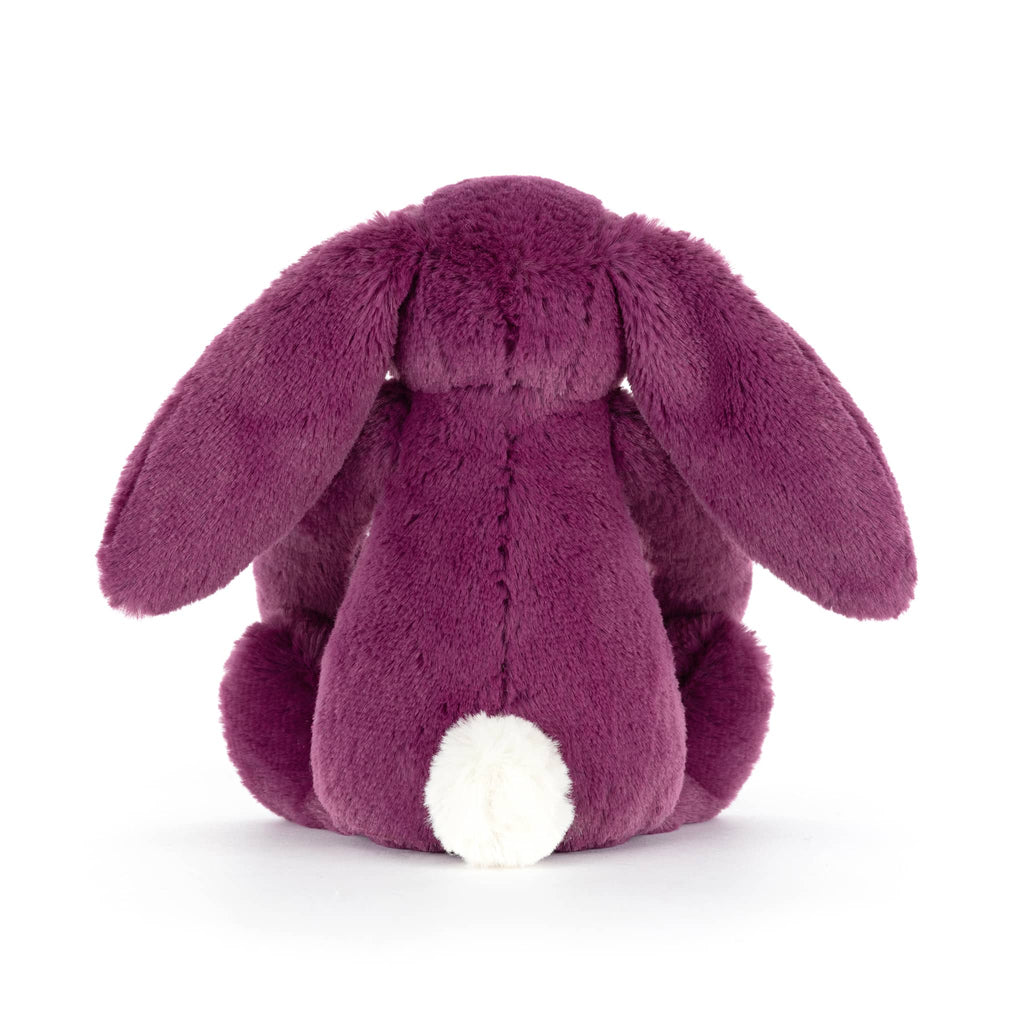 Purple plush bunny toy, back view, on a white background.