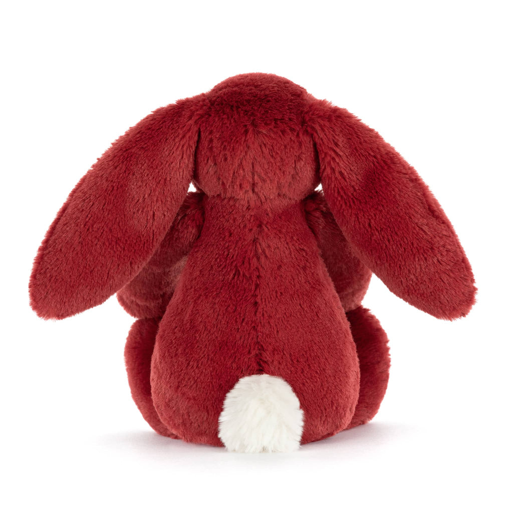 Red plush bunny toy, back view, on a white background.