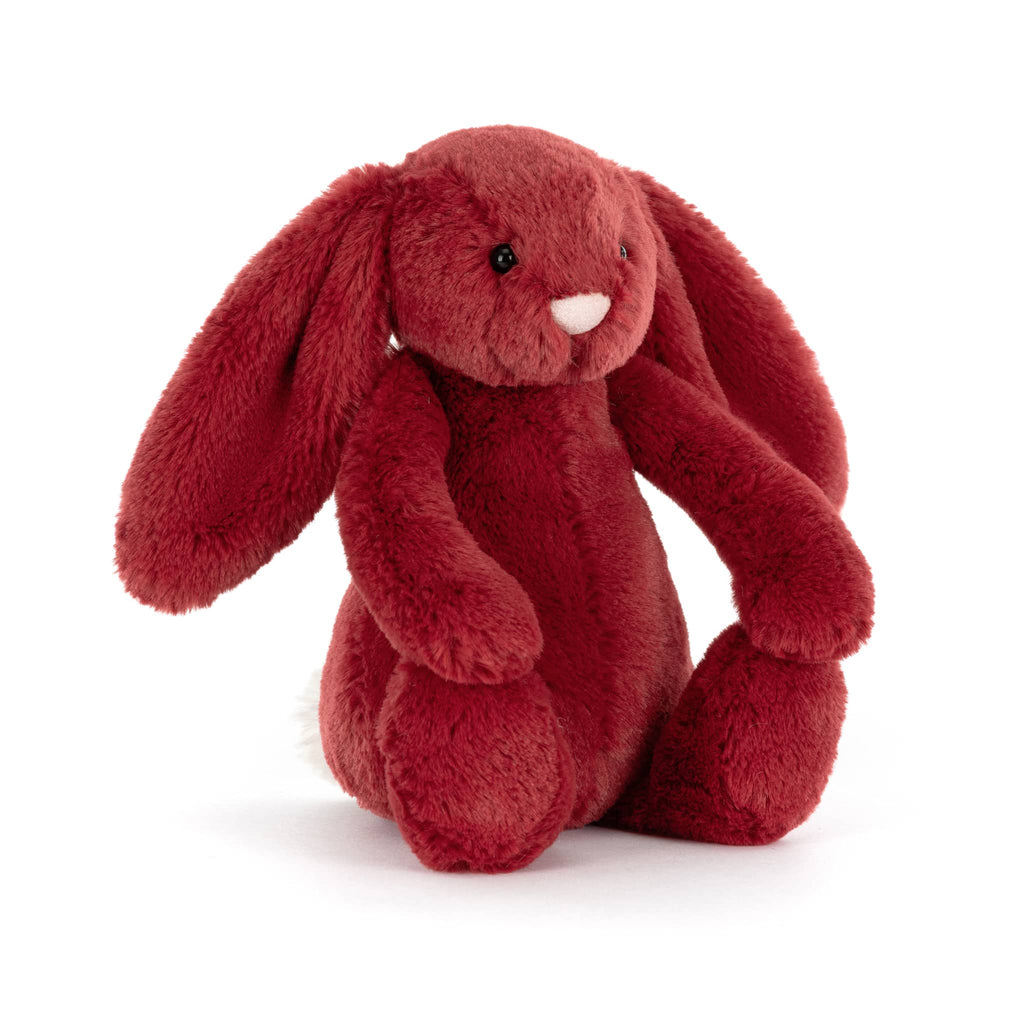 Red plush bunny toy, front angle view, on a white background.