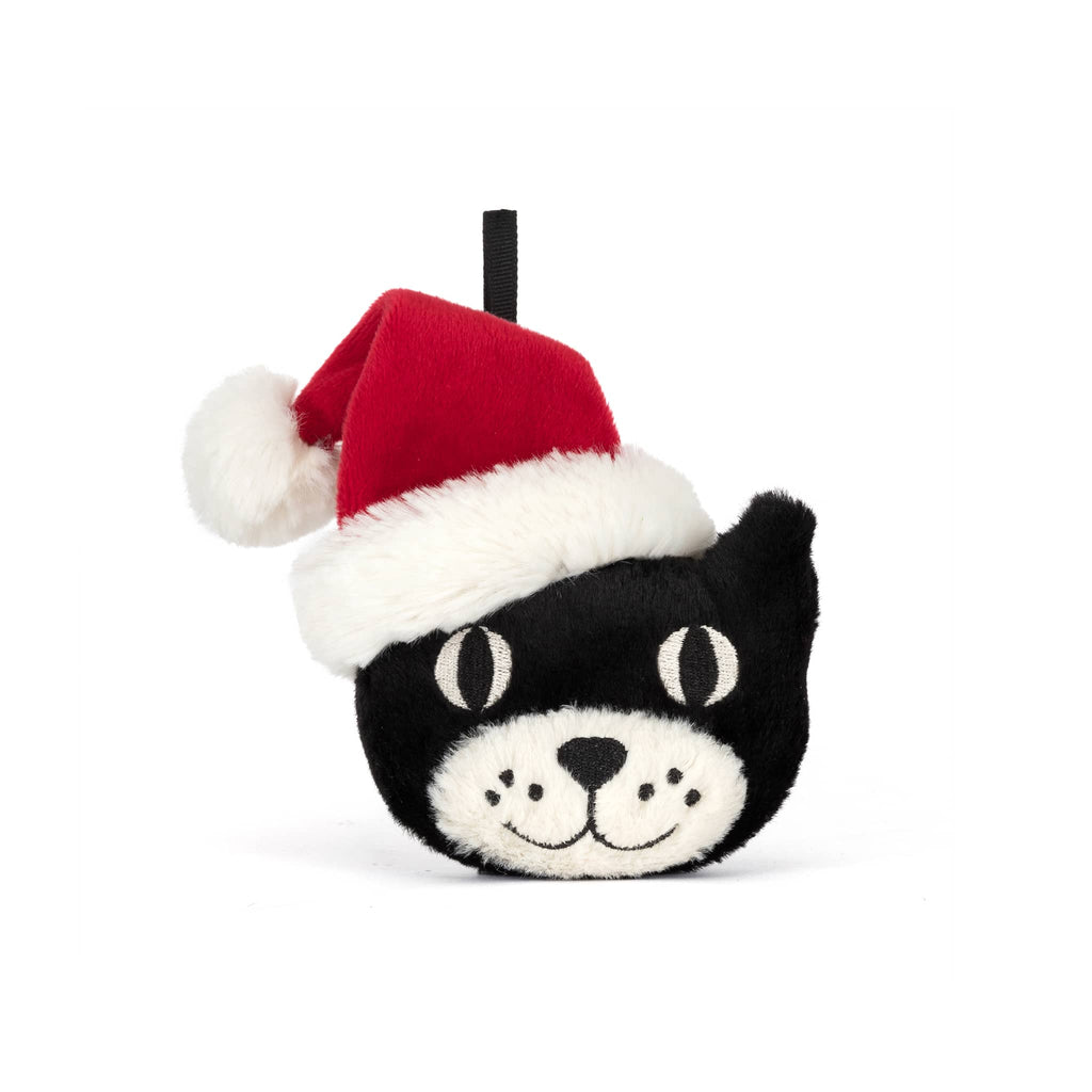 Plush black and white cat ornament with a santa hat, front view, on a white background.