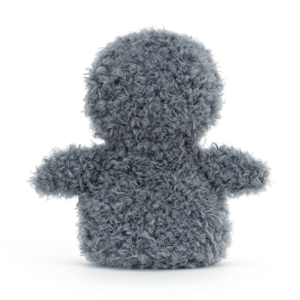 Stuffed penguin toy with gray back and wings, rear view on a white background.