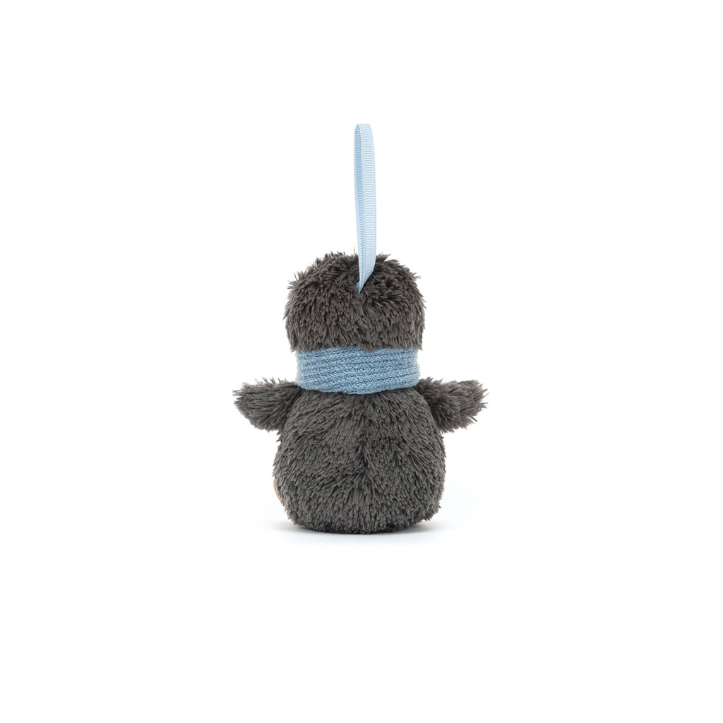 Plush penguin ornament with a blue scarf, back view, on a white background.
