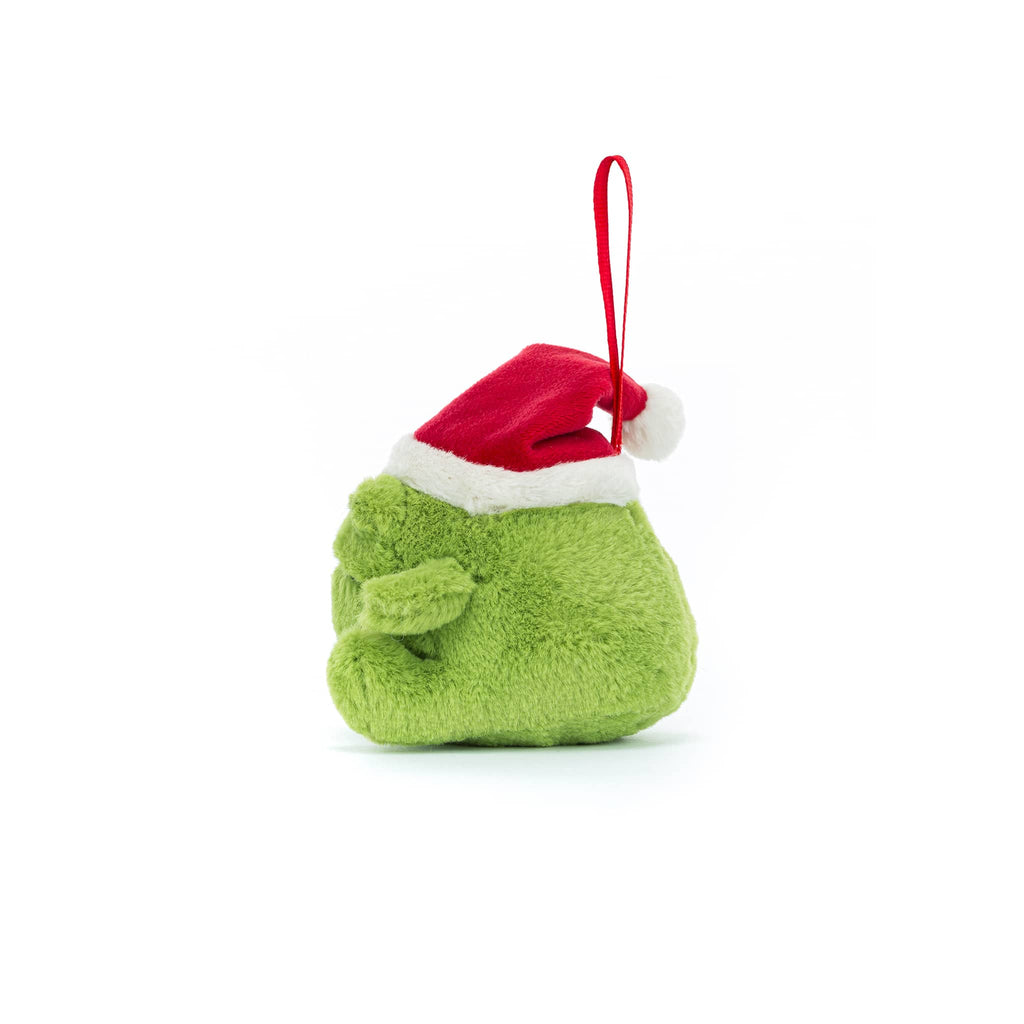 Green plush frog ornament with a red Santa hat, side view, on a white background.