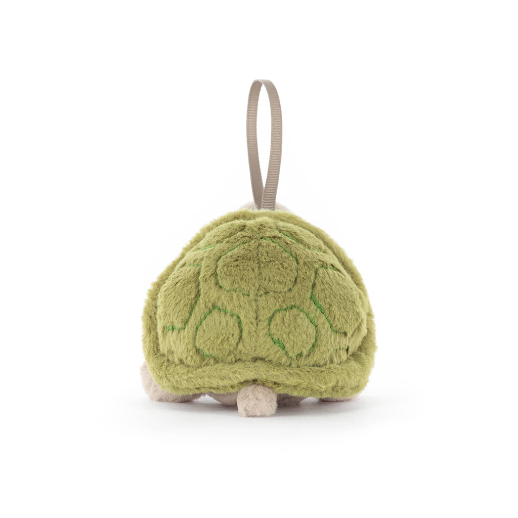 Plush turtle ornament with a blue scarf, back view, on a white background.