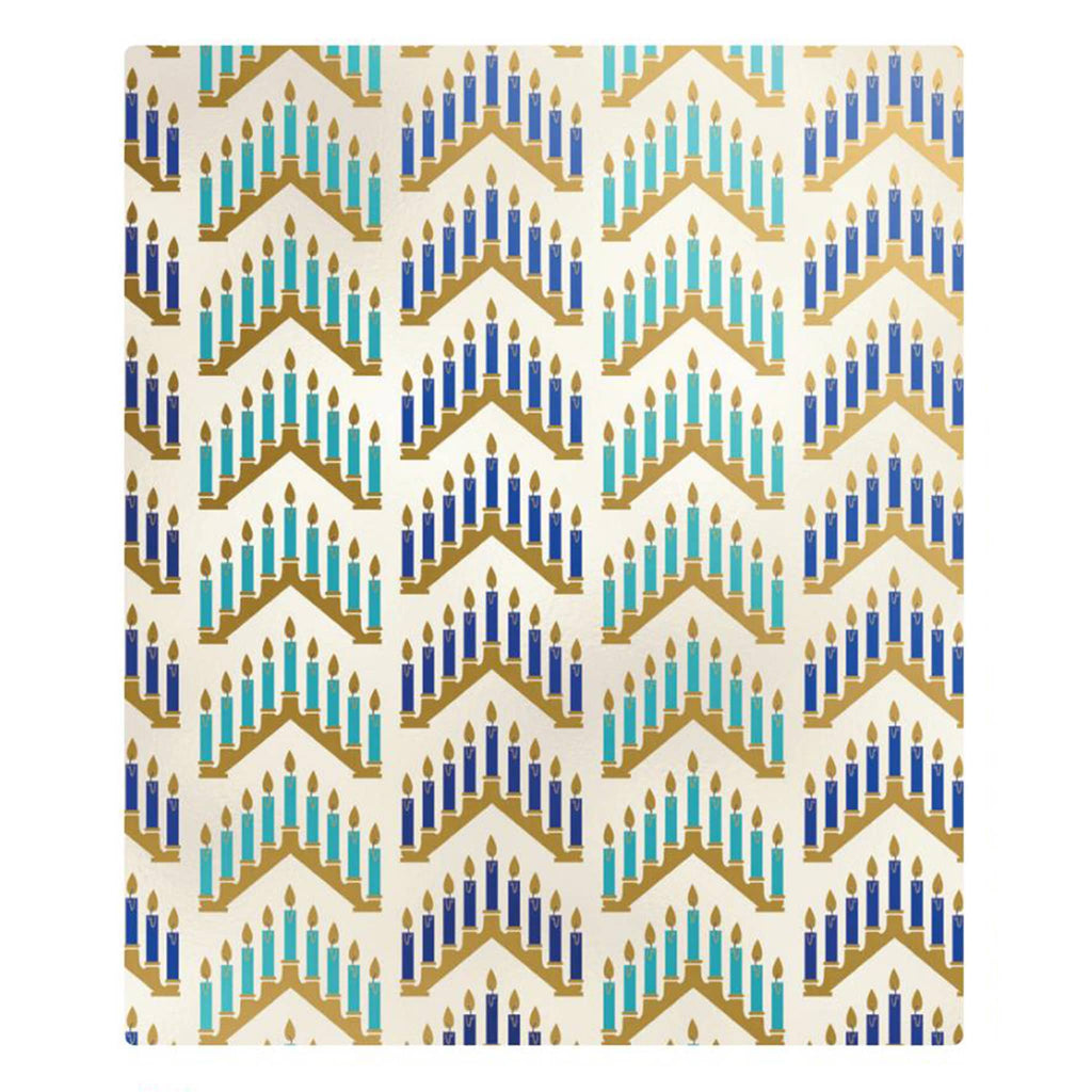 Wrapping paper with blue and gold menorah designs on a white background.