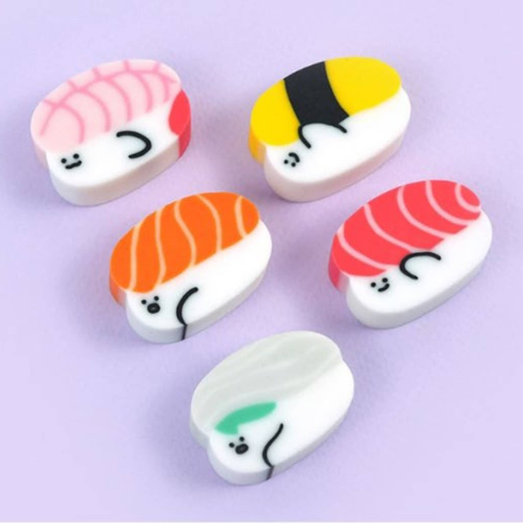 Set of five sushi-shaped erasers on a light purple background.