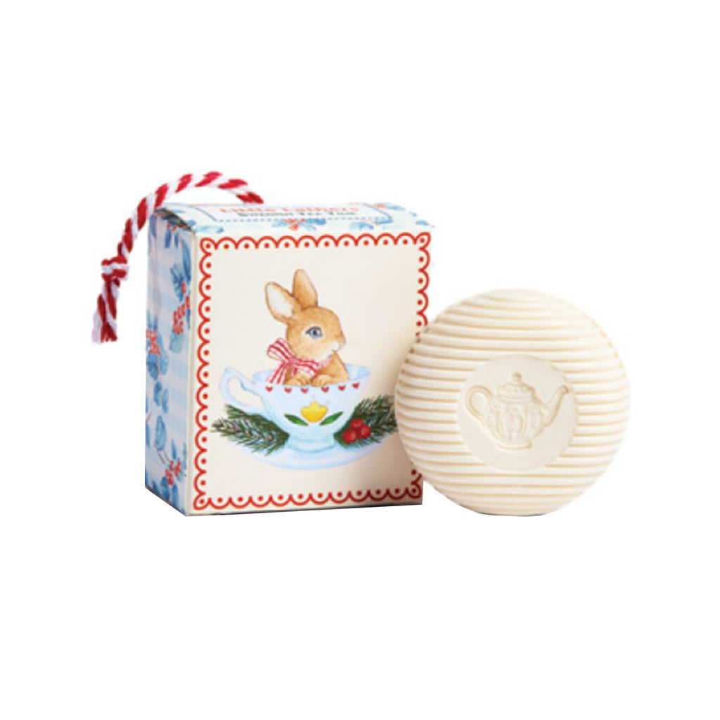 Round soap bar with teapot design with decorative box featuring a rabbit in a teacup illustration on a white background.