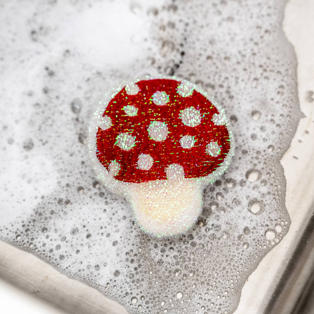 Kikkerland mushroom scrub sponge in soapy water.