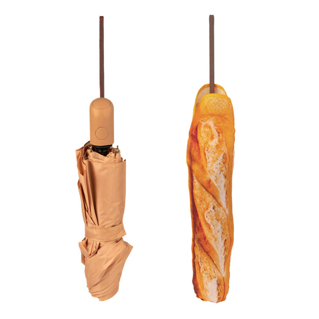 Closed tan umbrella shown beside same umbrella in a sleeve printed to look like a baguette, on a white background.