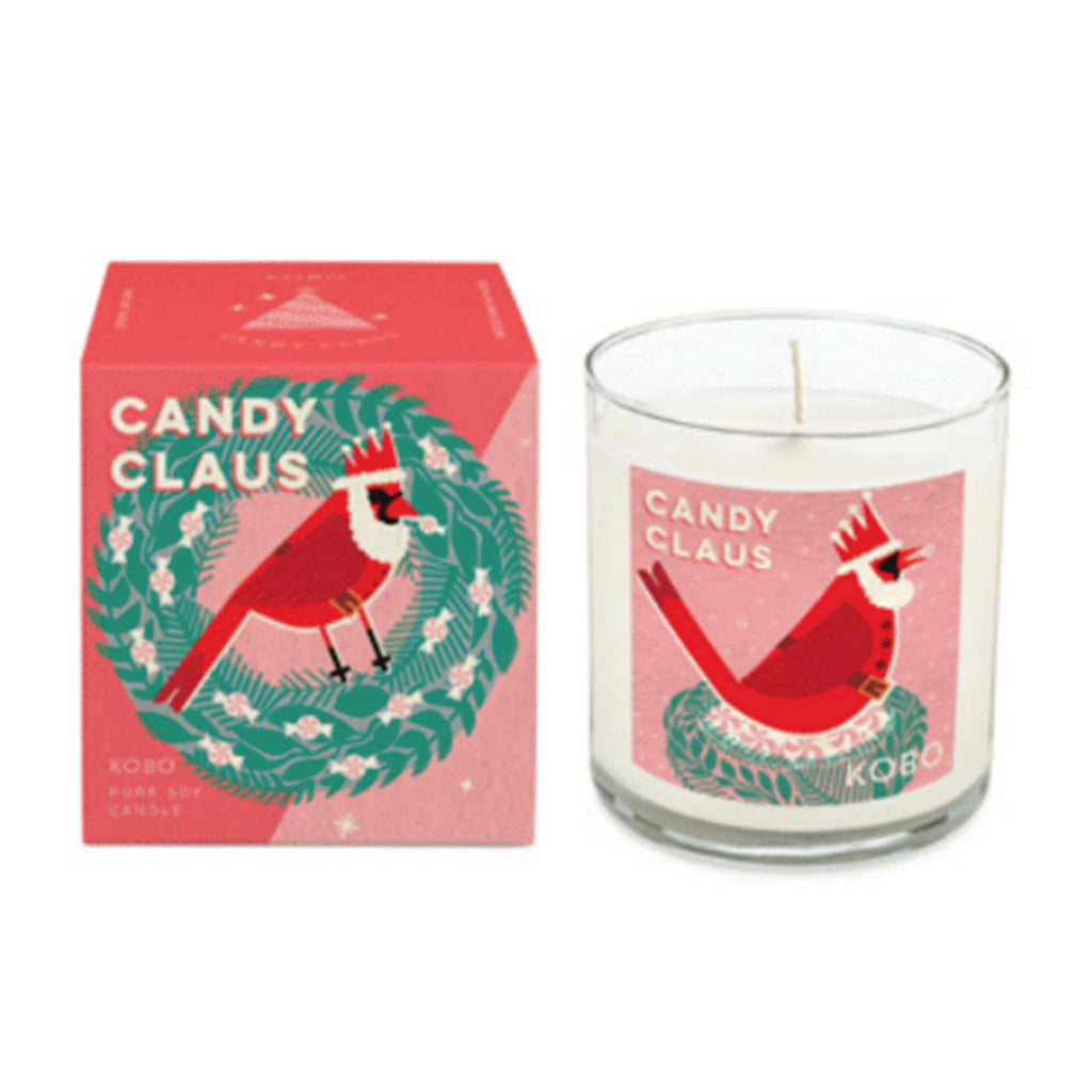 Kobo Candles Candy Claus scented holiday candle in clear glass vessel with pink label and matching illustration  gift box.