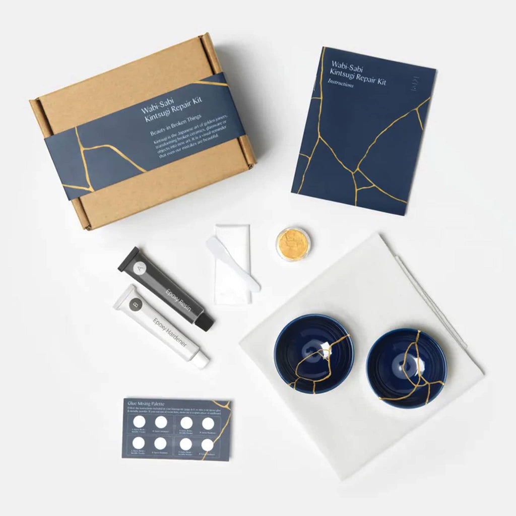 KonMari Wabi-Sabi Kintsugi Repair Kit, box packaging with contents and finished indigo ceramic bowls with veins of gold.