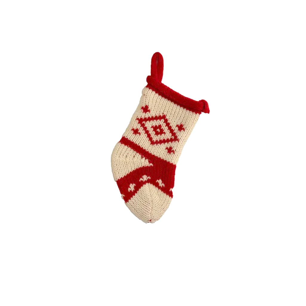 Kurt Adler small 5 inch knit Christmas stocking in white with red diamond design, red cuff and red loop hanger.