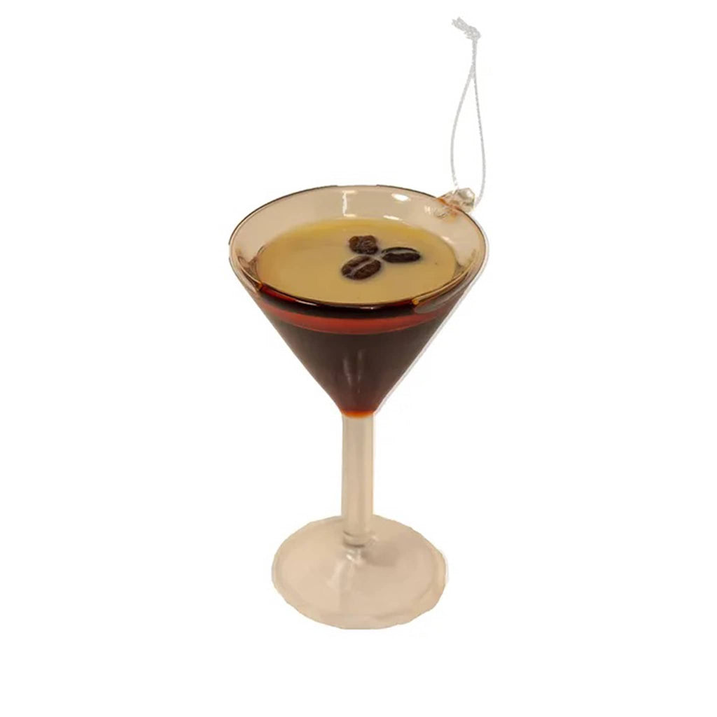 Decorative glass ornament shaped like a martini glass with coffee beans on a white background.