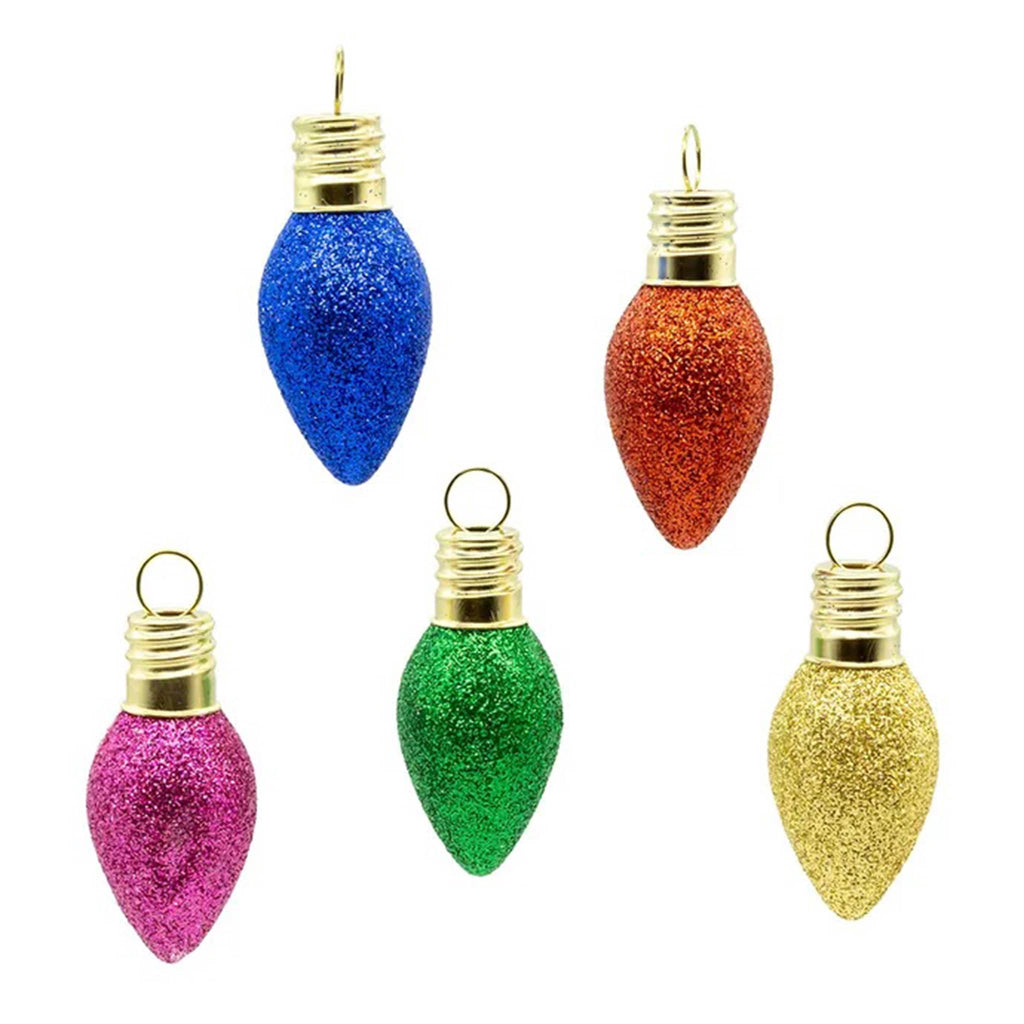 Set of 5 colorful glittery Christmas light bulb-shaped glass ornaments on a white background.