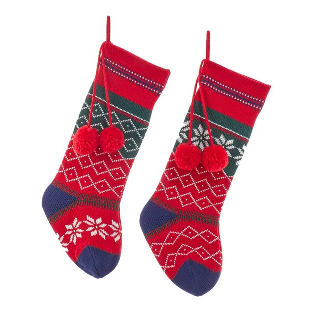 Two red Christmas stockings with patterned design and pom-poms on a white background.