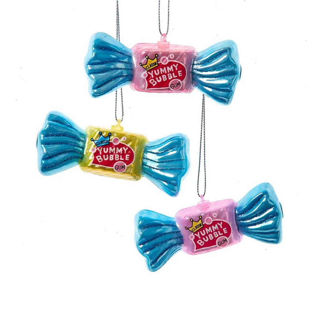 Yummy Bubble glass ornaments that look like wrapped bubble gum with blue ends in 3 colors, on a white background.