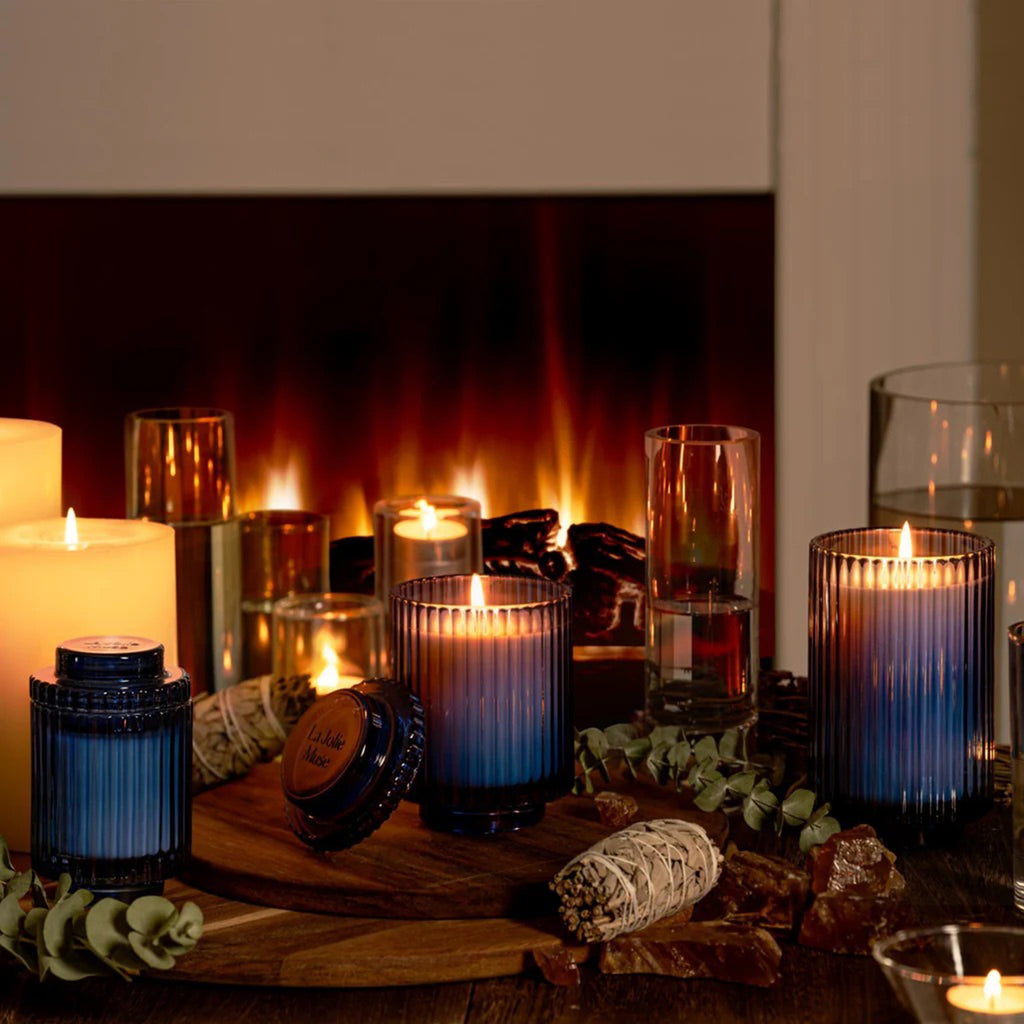 La Jolie Muse Amelie Eucalyptus Alpine Sage scented soy wax candle in ribbed blue glass vessels with lids, in 3 sizes.