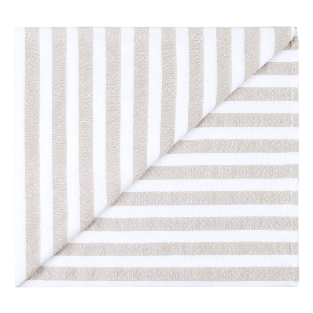 Las Bayadas La Catalina beach blanket towel with beige and white stripes, folded into a square.