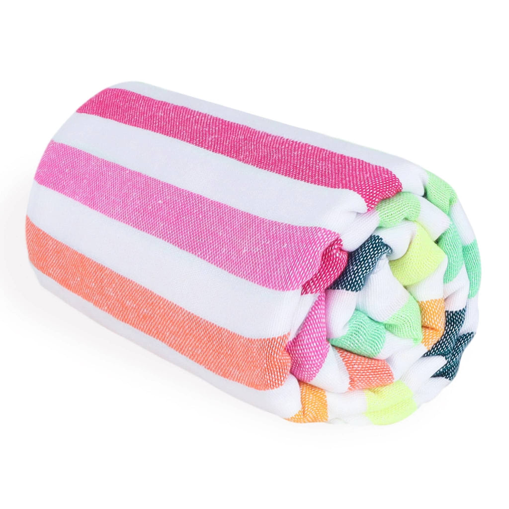 Las Bayadas La Gloria beach blanket towel with stripes in shades of pink, orange, green and white, rolled up.