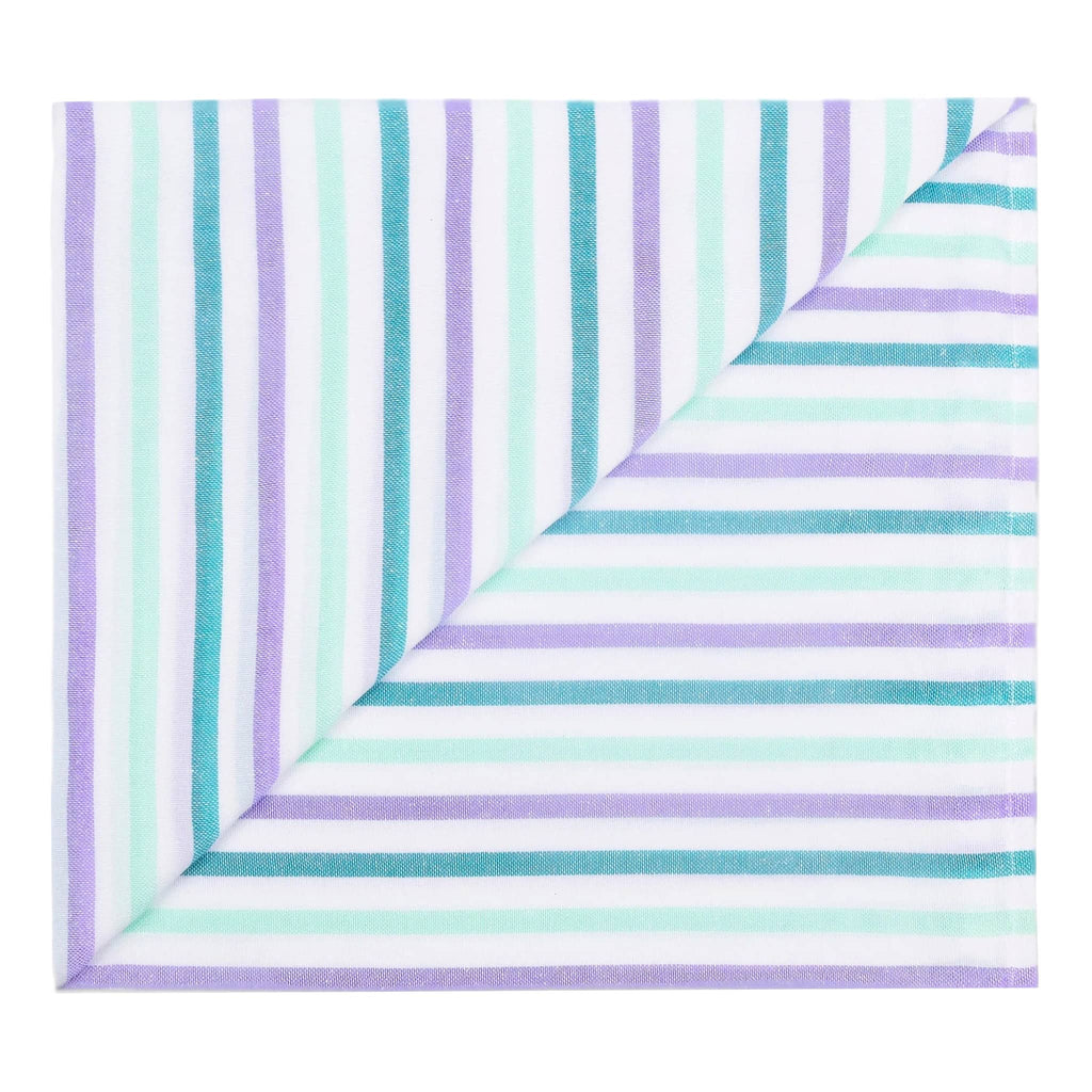 Las Bayadas La Rocio beach blanket towel with muted purple, aqua, green and white stripes, folded into a square shape