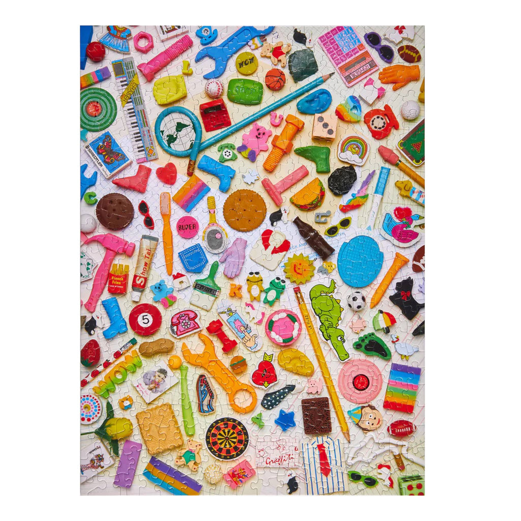 Puzzle image of assorted colorful stationery items on a white background.