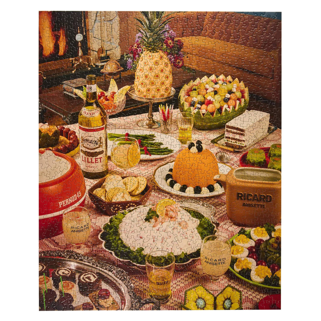 Puzzle depicting a vintage-style table setting with food and drinks, featuring a Lillet bottle.