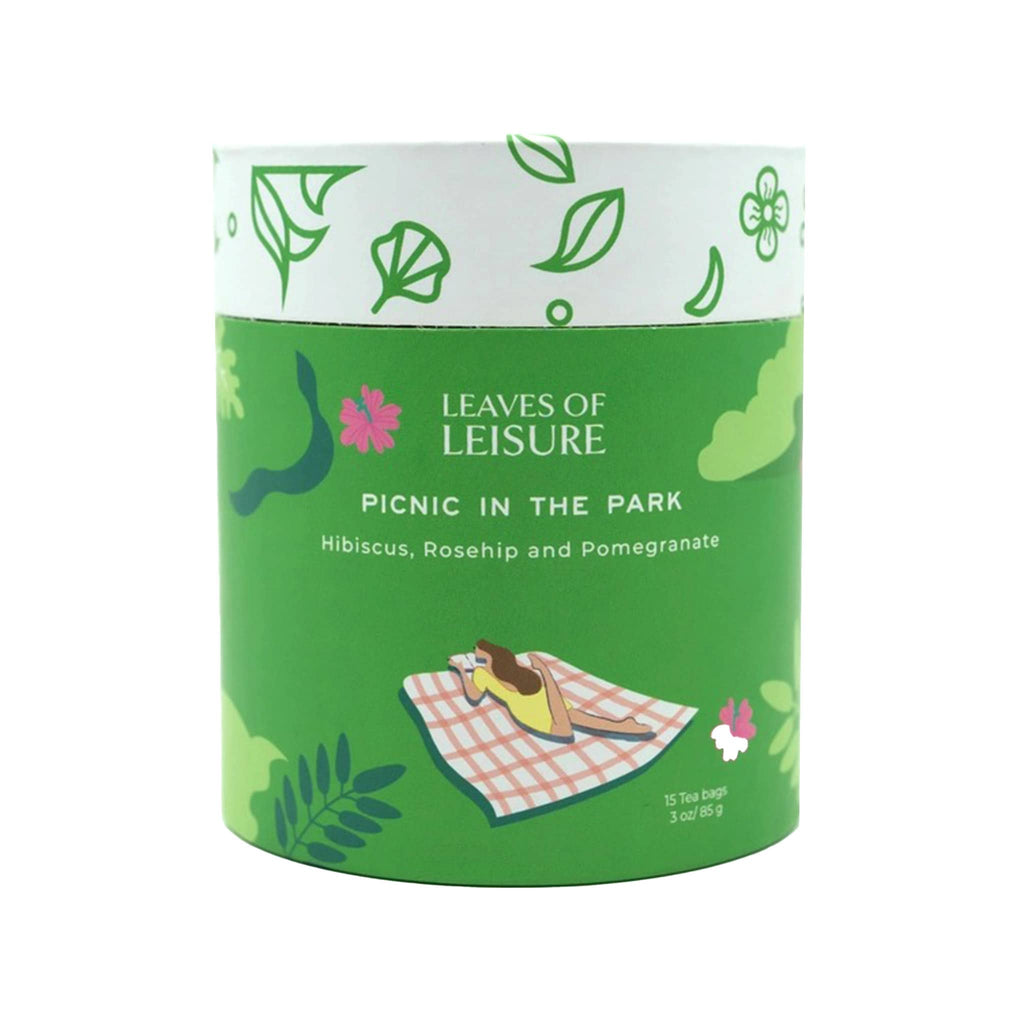 Leaves of Leisure Picnic in the Park Caffeine-Free Organic Herbal Tea in illustrated green canister packaging, front view.