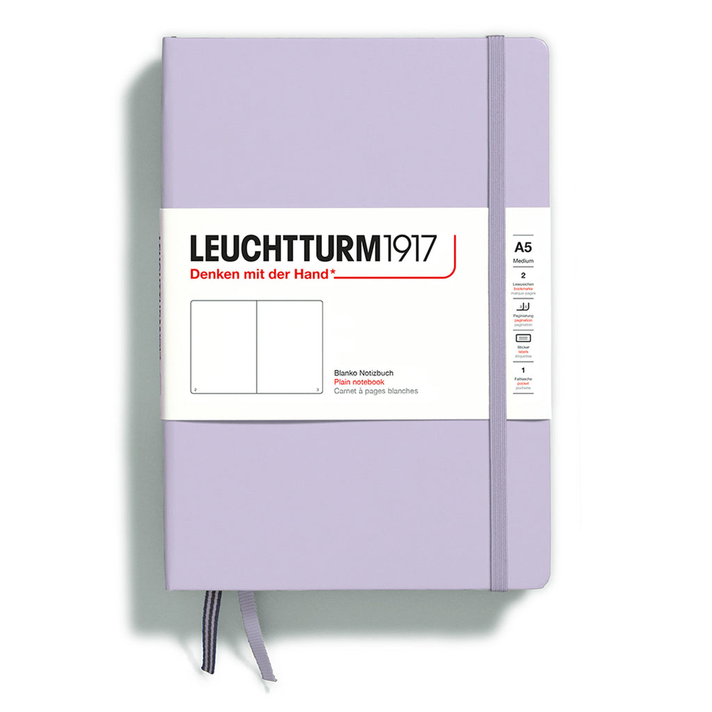 Leuchtturm1917 hardcover A5 medium notebook with plain pages and a lilac cover and elastic band.