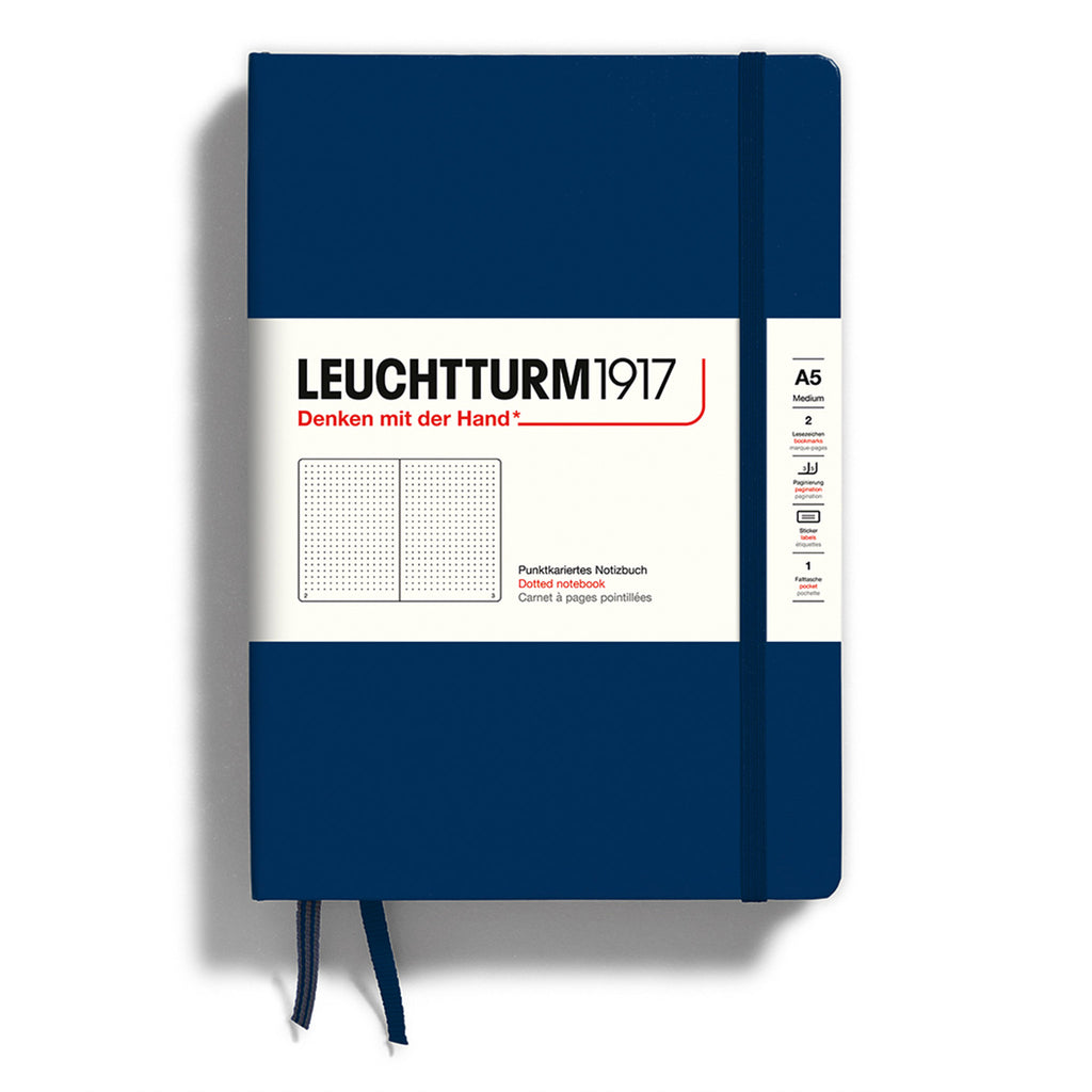 Leuchtturm1917 hardcover A5 medium notebook with dotted pages and a navy blue cover and elastic band.