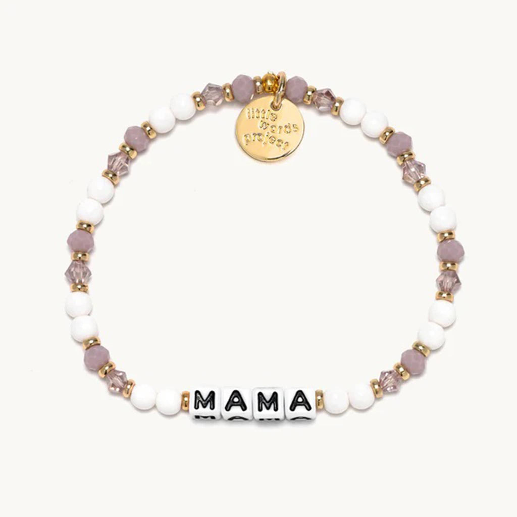 Little Words Project Mama beaded elastic bracelet in lavender latte bead design; white beads with opaque and translucent faux crystal beads with gold spacer beads and letter beads.