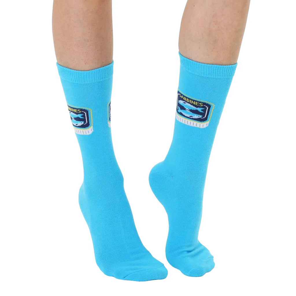 Living Royal sardine tinned fish blue unisex crew socks on model.