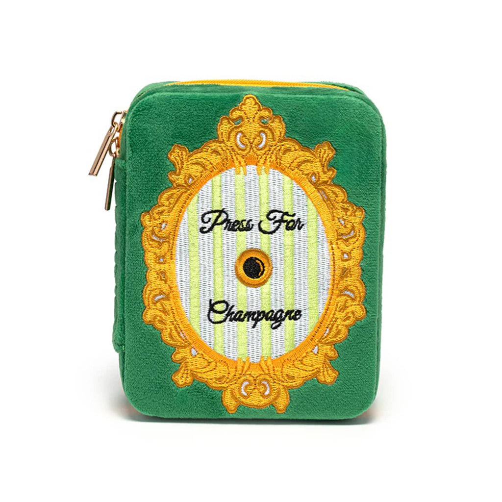 Rectangular green velvet jewelry case with text 'Press For Champagne' and illustration embroidered on the front, shown on a white background.