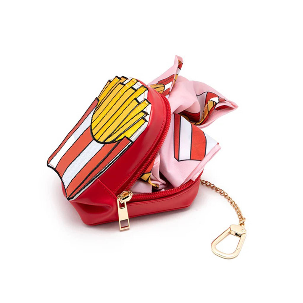 Small red bag charm with a gold chain and colorful tote coming out, on a white background.