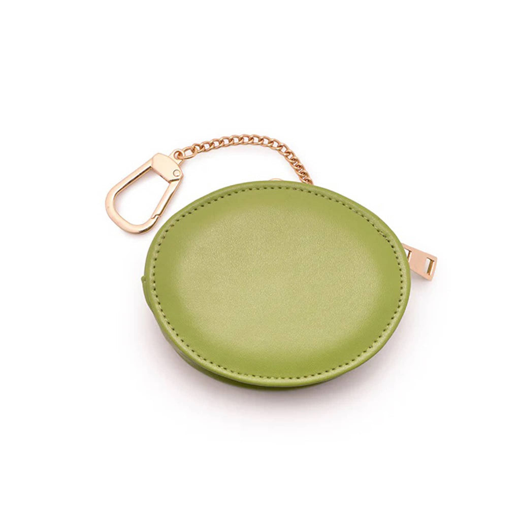 Green round bag charm with gold chain on a white background.