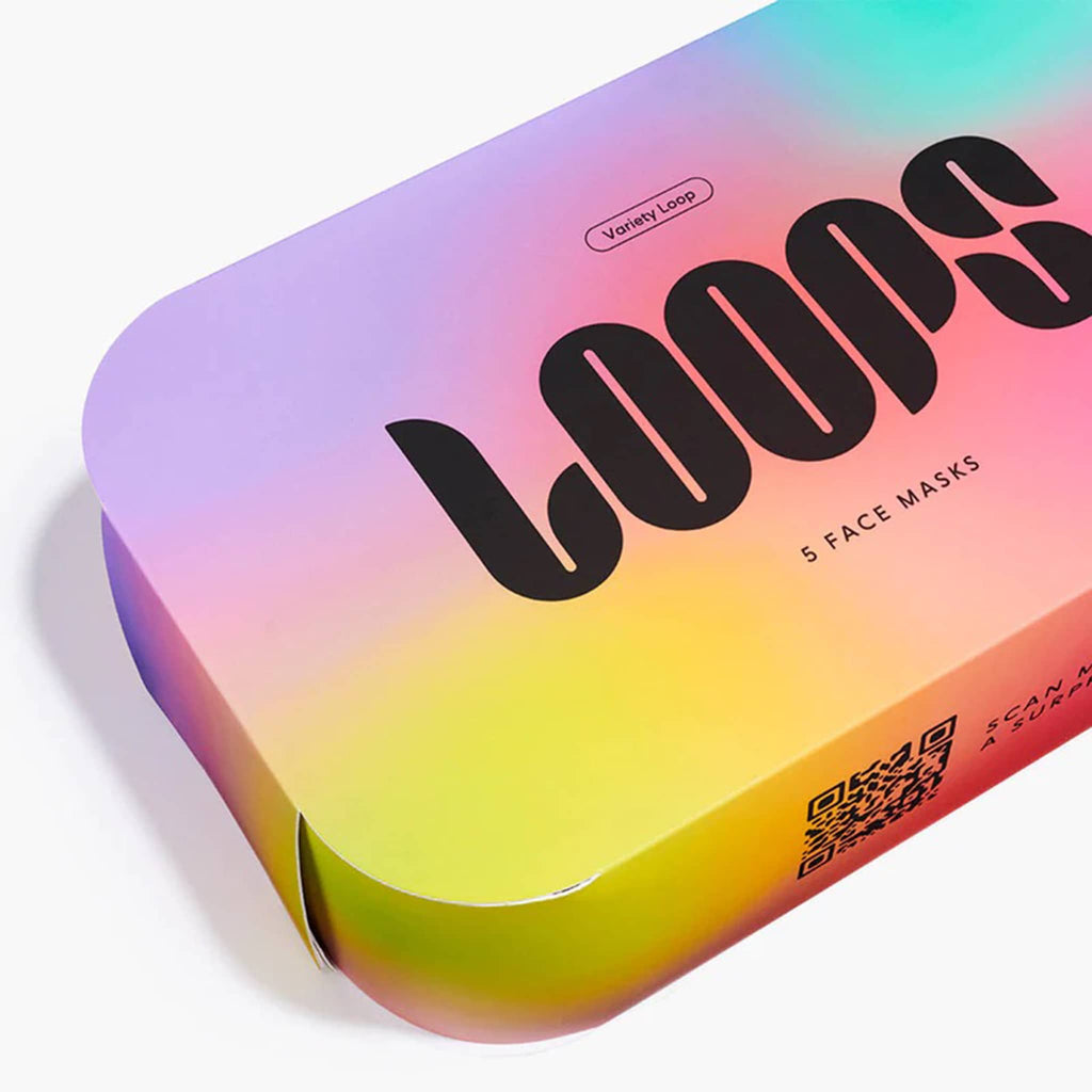 Colorful packaging of 'LOOPS' face masks with a gradient effect, detail of box, on a white background.