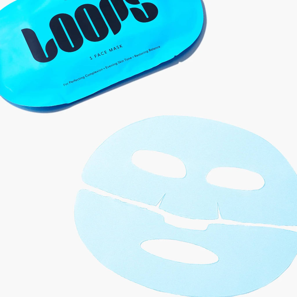 Blue face mask with 'LOOPS' branded packaging on a white background.