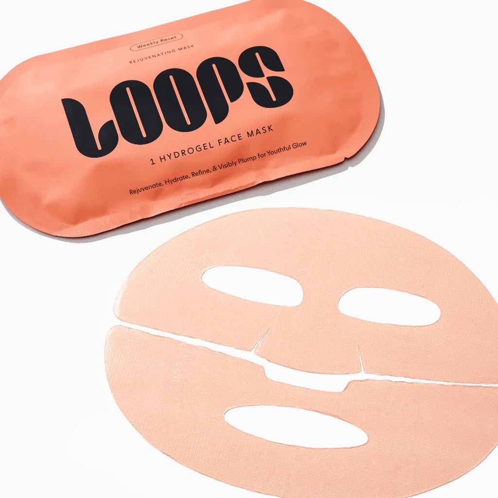Loops orange hydrogel face mask with packaging on a white background.