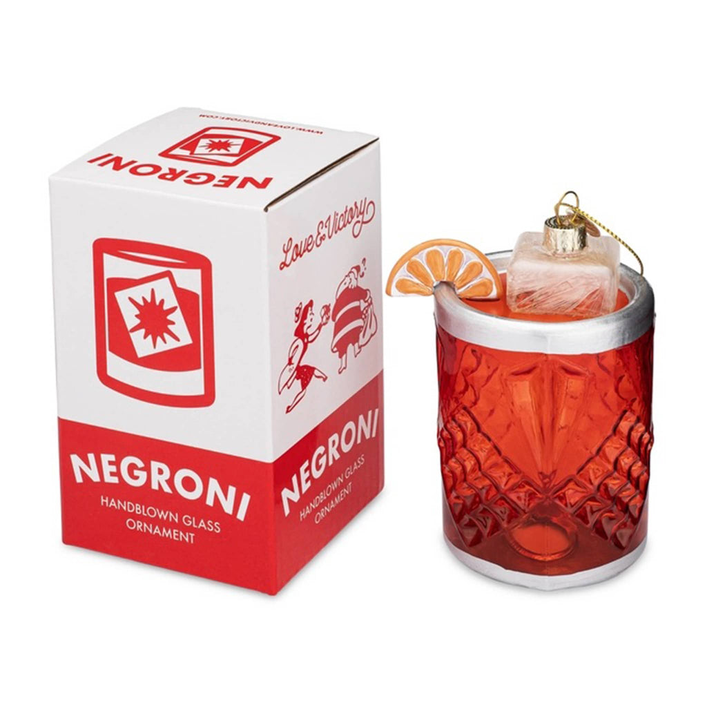 Love and Victory Negroni hand-blown, hand-painted glass holiday cocktail ornament with red and white box packaging.