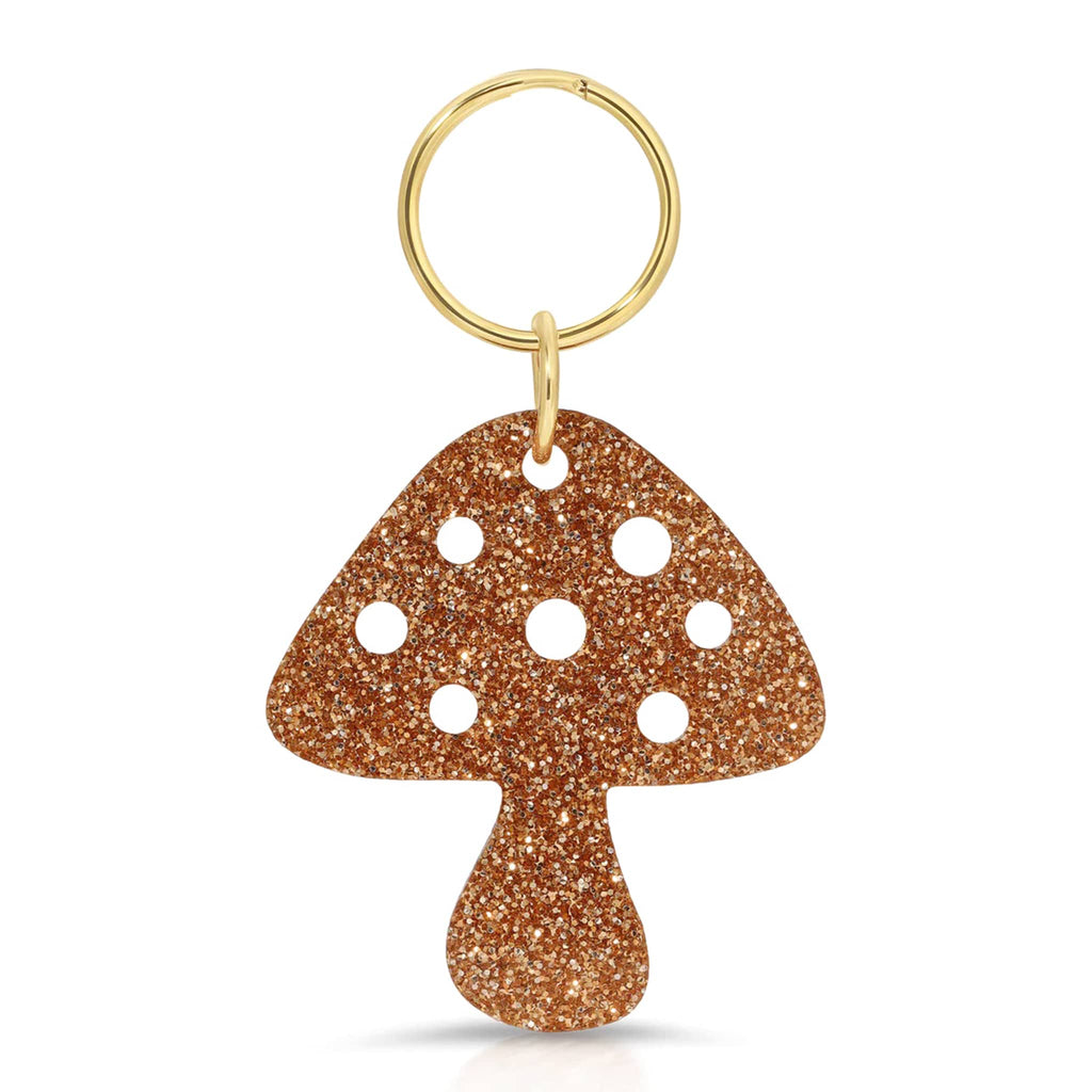Mushroom-shaped gold glitter keychain with gold ring on a white background.