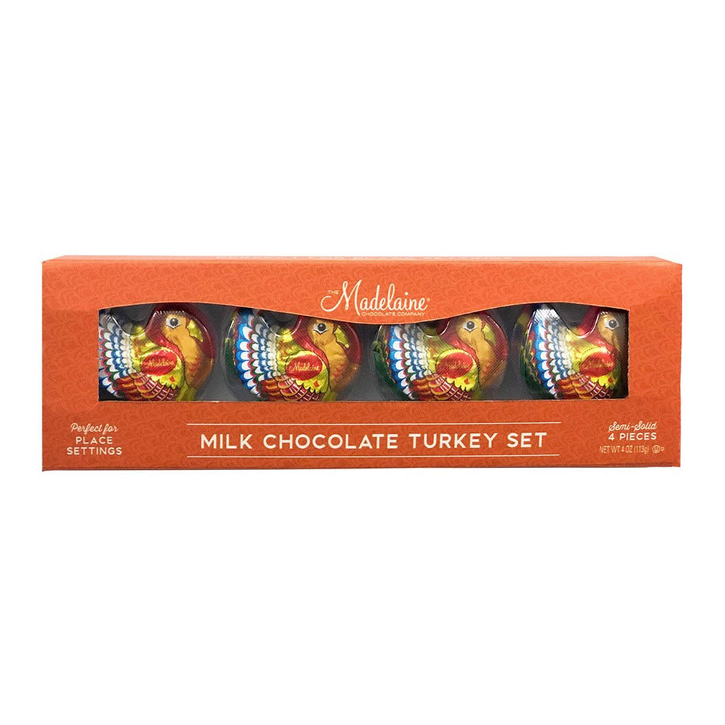 Milk chocolate turkey set in an orange box with 'Madelaine' branding.