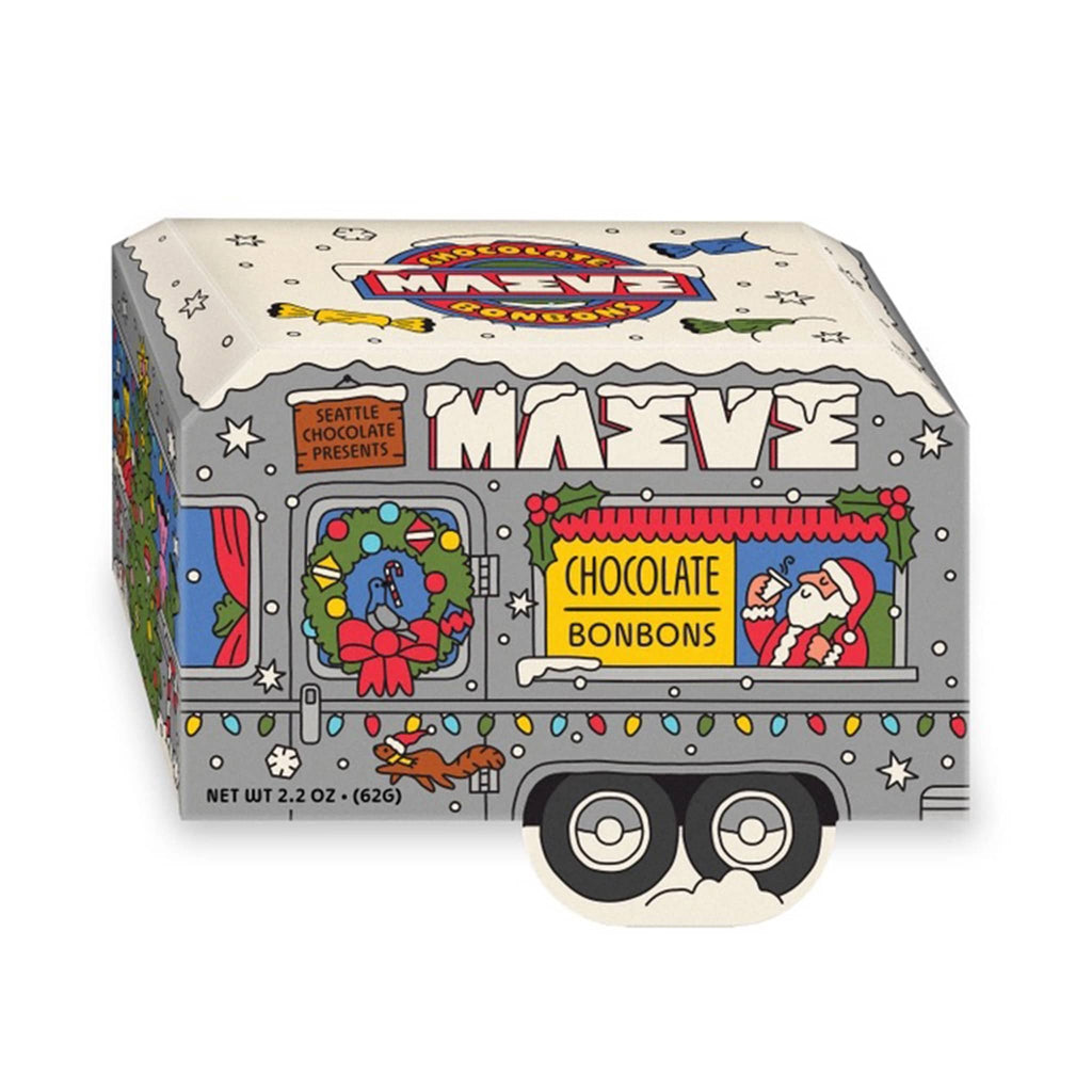 Maeve chocolate bonbons in a box that looks like a camper trailer with Santa illustration, on a white background.