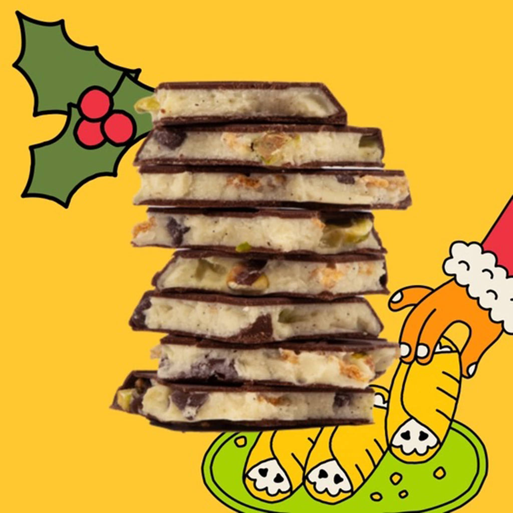 Maeve Cozy Cannoli dark and white chocolate truffle bar, stacked squares showing the inside of the bar on a yellow illustrated background.