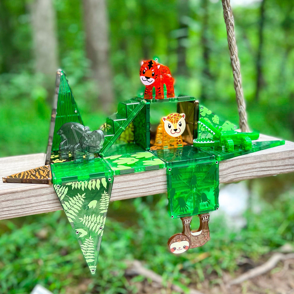 Magna-Tiles Jungle Animals themed magnetic tile kids 25 piece building set, in play outside on a swing.