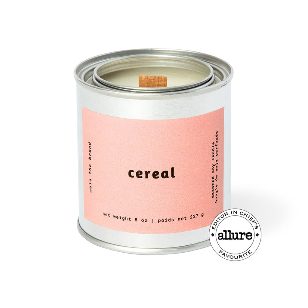 Mala the Brand Cereal Scented 8 ounce candle in metal tin with wood wick and a dusty pink label.